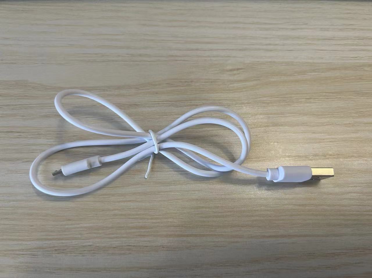 USB charging cable for Neck Lifting Skin Massager Device for Anti-Aging Benefits, compatible with standard USB ports.