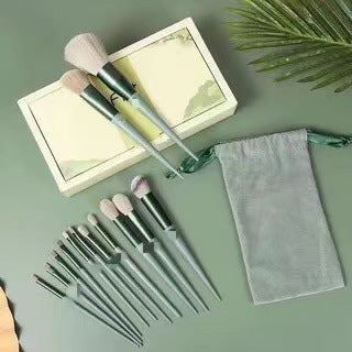 Green-themed 13Pcs Makeup Brush Set with synthetic bristles, includes foundation, highlighter, and blending brushes with mesh pouch and gift box.